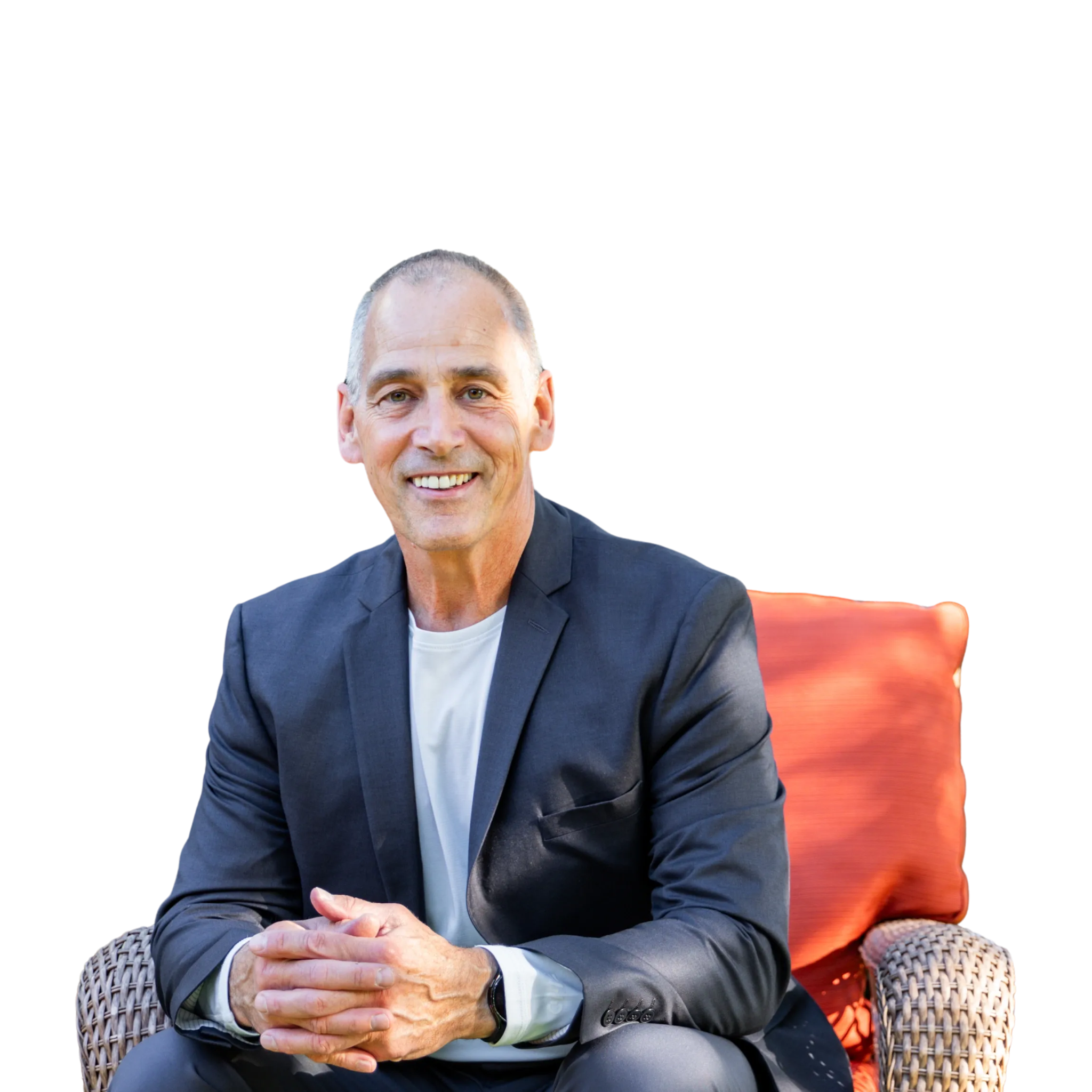Jim Brayshaw seated outdoors